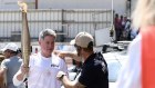 Nine CEO Mike Sneesby carries the Olympic torch