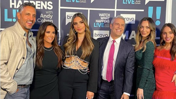 Mauricio, Kyle  with daughters and Real Housewives EP Andy Cohen.