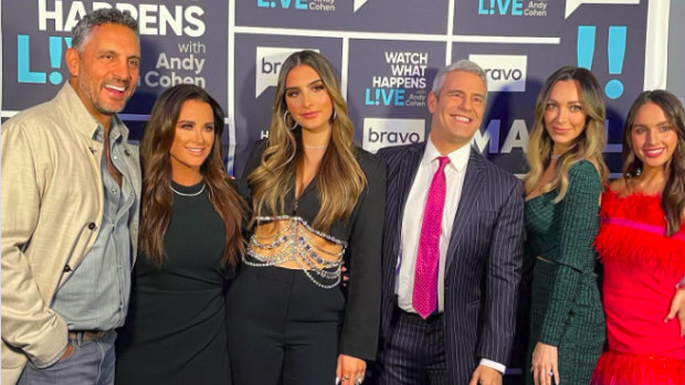 Mauricio, Kyle  with daughters and Real Housewives EP Andy Cohen.