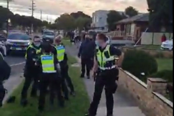 Video footage shows a gathering of large groups of people walking in Dandenong and police presence on the ground. 