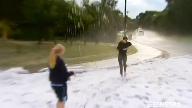 Residents in Carine made the most of a winter ice storm that covered their street with hail.