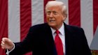 US President Donald Trump tosses a “Make America Great Again” hat during his tariff announcement in the Rose Garden of the White House on Wednesday.