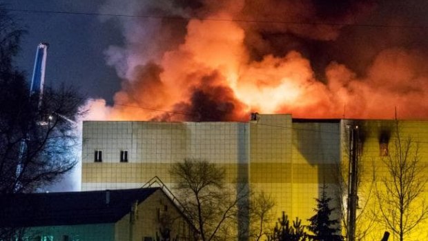 The fire burning ferociously in the Siberian shopping mall on Sunday afternoon. 