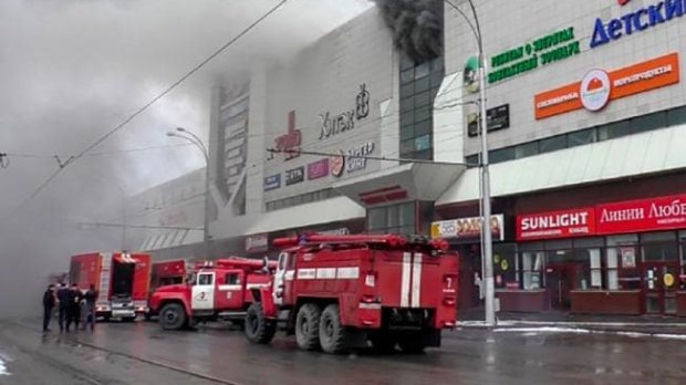 Firefighters outside the shopping mall. It is believed the fire started in a children's play area.