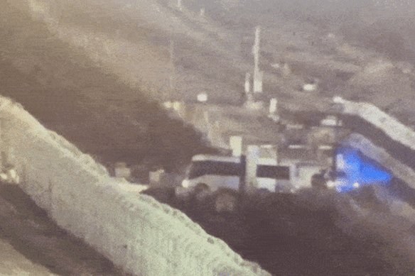 A bus containing the freed hostages drives into Israeli territory. 