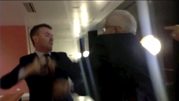 Pauline Hanson adviser James Ashby, left, and Senator Brian Burston in an  altercation at Parliament House. Burston later admitted smearing Hanson's door with blood.