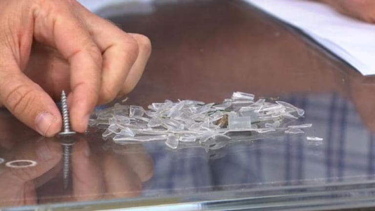 Plastic and a screw collected from the Spotless Stadium pitch.