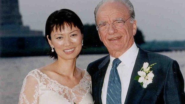 Rupert Murdoch and Wendi Deng pose near the Statue of Liberty after being married on board Murdoch's yacht in New York Harbor in 1999, 17 days after divorcing Anna.