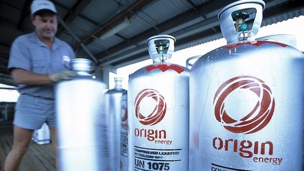 Origin has returned to a dividend and marked a return to profit as it continues to drive down debt levels.