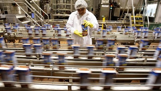 Product rushes along the UHT line at a Freedom Foods factory.