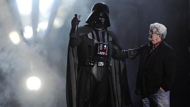 George Lucas with his most famous costumed villain, Darth Vader.