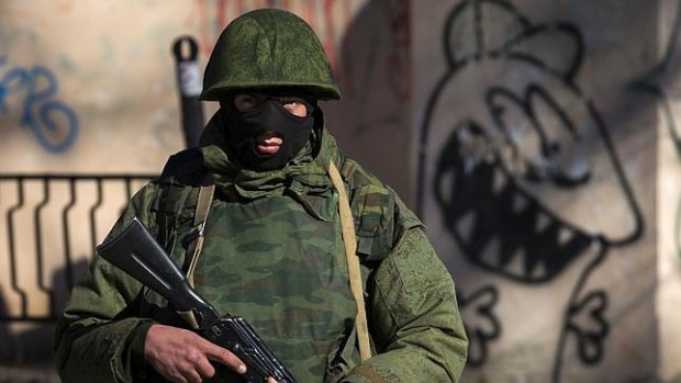 An unidentified soldier stands near a Ukrainian military base in Simferopol. 