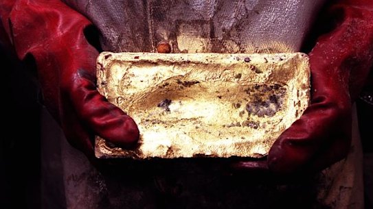 A foundry worker holds a piece of gold bullion; Newcrest Mining’s new chief executive, Sandeep Biswas, will be paid a fixed salary of $2.3 million fixed salary, higher than his predecessor’s, and incentives are more generous as the company hopes to grow further.  