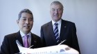 Rex executive chairman Lim Kim Hai and deputy chairman John Sharp, with another model airplane. 