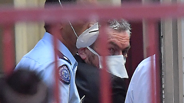 Borce Ristevski outside the Supreme Court, wearing a face mask due to a flu outbreak at Melbourne's remand centre.