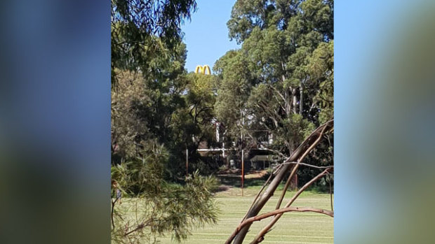 The McDonald's sign as seen from Jolimont Primary School's oval.