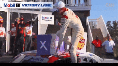Race winner falls from roof of car and breaks collarbone