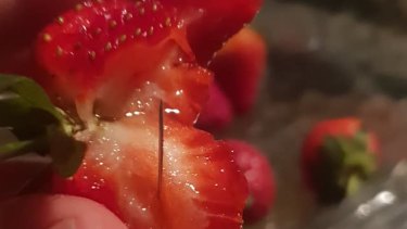 A woman in Wingham, NSW, posted pictures of strawberries with needles in them to Facebook, saying she purchased them at the local Coles.