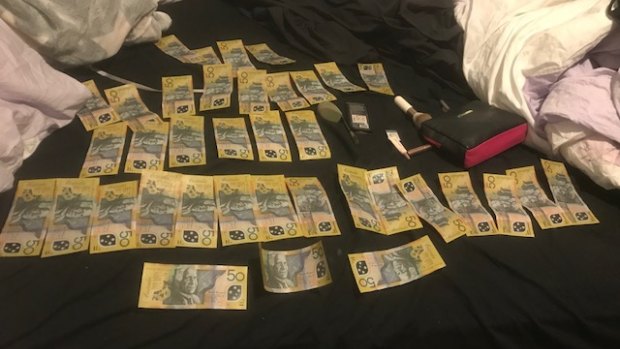 Cash that was seized by police during a search in Rivett on June 5.
