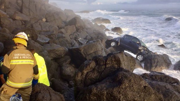 Paramedics attended the scene to rescue a man whose car went off a cliff at Point Danger.