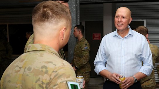 Peter Dutton met soldiers in Townsville last month.