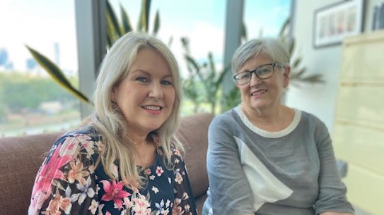Jane Goodwin (left) a breast cancer survivor, with Professor Georgia Chenevix-Trench, who led a recent study identifying 191 genes associated with raised breast cancer risk.