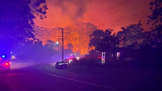 A photograph of the bushfire at Lower Beechmont on Friday night. Defence is investigating any link between the fire and a recent blaze at Kokoda Barracks.