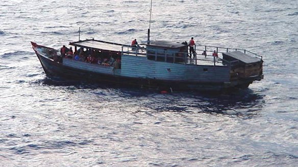 Asylum seekers rescued from a sinking boat.