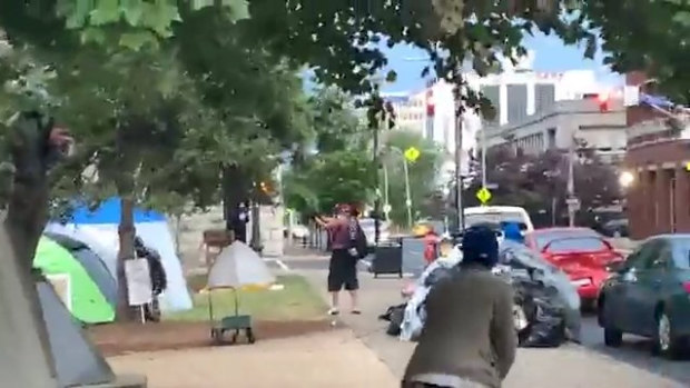 Video posted on social media appeared to show a man opening fire into Jefferson Square Park as people scrambled for cover. 