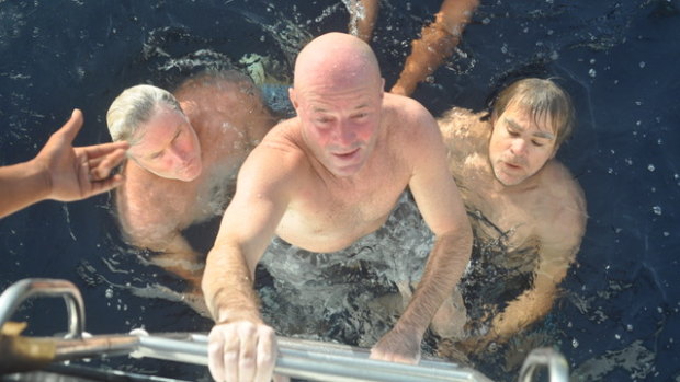 Brett Archibald being pulled from the water after surviving nearly 29 hours in Indonesian waters. 