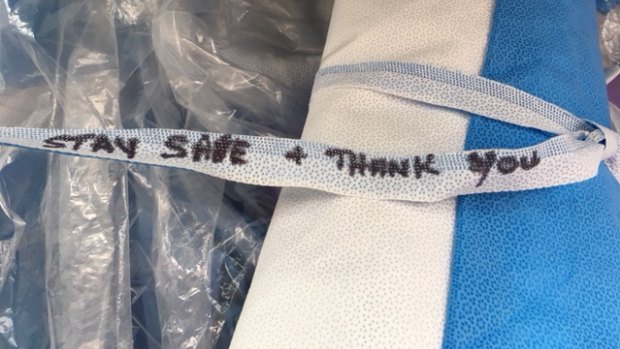 One of the gowns made of recycled medical waste distributed to medical workers in the Barwon Health network, with the message "Stay Safe and Thank You"