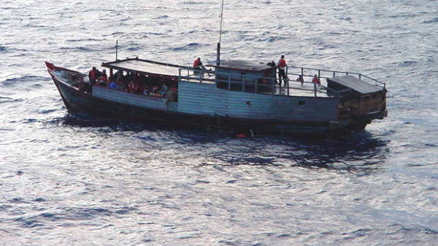 Asylum seekers rescued from a sinking boat.