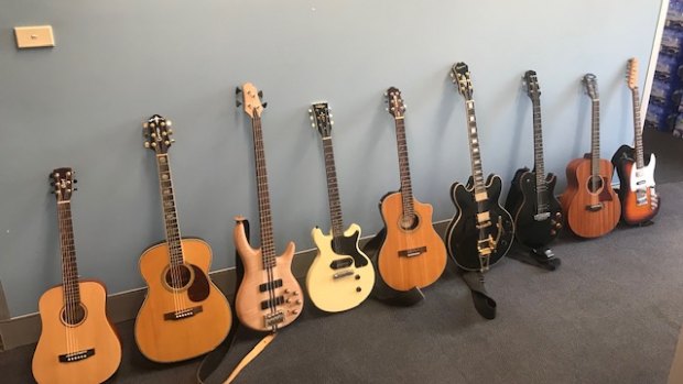 Nine guitars discovered by ACT Policing during a search of a Gungahlin home on Friday. The search also uncovered a cannabis cultivation operation at the premises.