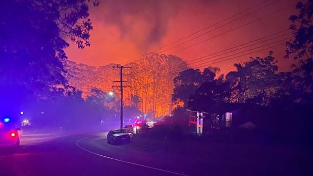 A photograph of the bushfire at Lower Beechmont on Friday night. Defence is investigating any link between the fire and a recent blaze at Kokoda Barracks.