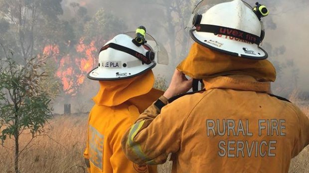 Firefighters had all of the state's bushfires contained on Saturday, but winds could help the flames break out.