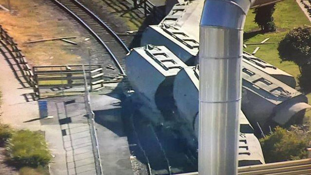 Two people have been taken to hospital after a driverless train derailed in Devonport.