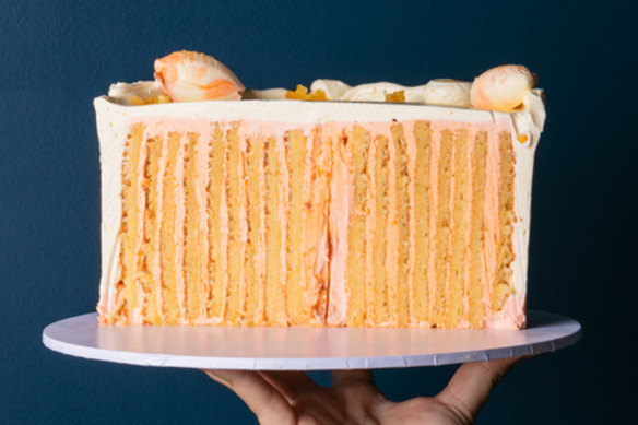 Zesty citrus layer cake created by rolling cake sponge like a Swiss roll.