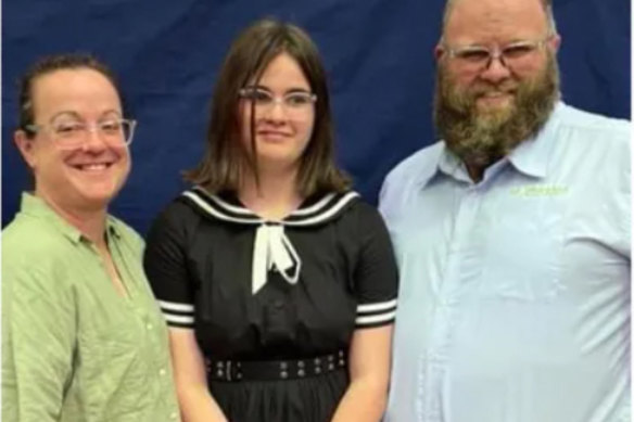 Mia Rossiter flanked by her parents, Danica and Paul Rossiter.
