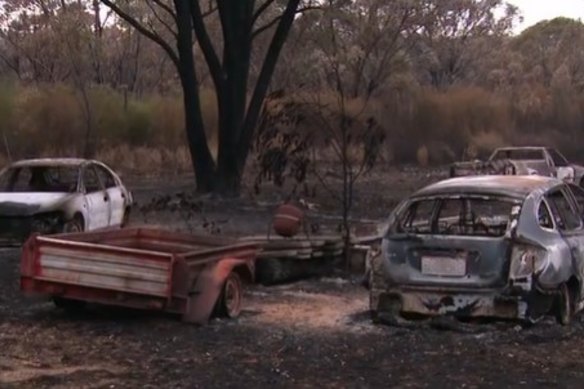 Burnt-out cars after bushfires hit southern Queensland.