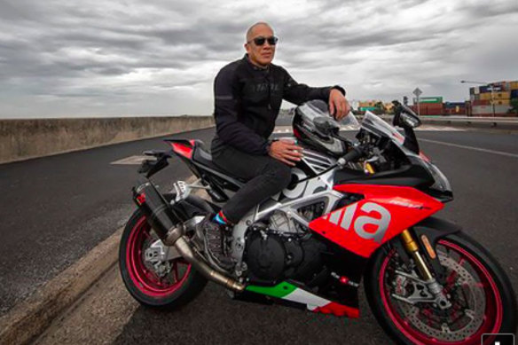 Charlie Teo and his motorcycle.