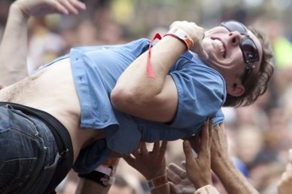 Music journalist Mikey Cahill crowd-surfs at Golden Plains Festival in 2010.