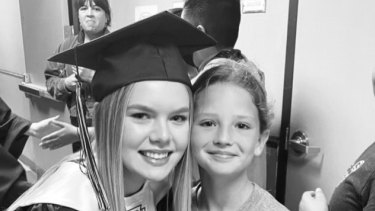 The now deceased Makenna Lee Elrod pictured with her big sister Kadence at her graduation. 