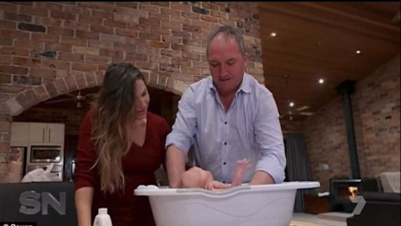 Joyce and partner Vikki Campion giving their son Sebastian a bath for the cameras.