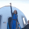 Katy Perry kisses the ground after all-female celebrity Blue Origin space flight.
