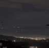 Helicopters are seen flying over Caracas after explosions rocked the city.