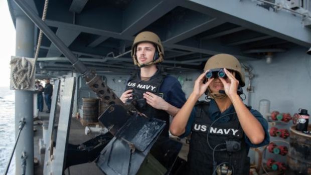 US sailors search for surface contacts during a Strait of Hormuz transit in 2019.