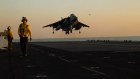 A Harrier aircraft lands on the flight deck of the USS Bataan operating in the Red Sea.