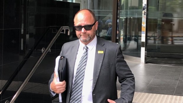 Barry Urban leaves court on Wednesday.