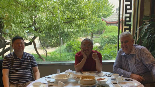 David Zhu, Eddie Zhi and Craig Newton in Beijing in October 2019.