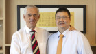 Michael Gu (right), founder of failed property group iProsperity, with Sydney solicitor John Landerer.